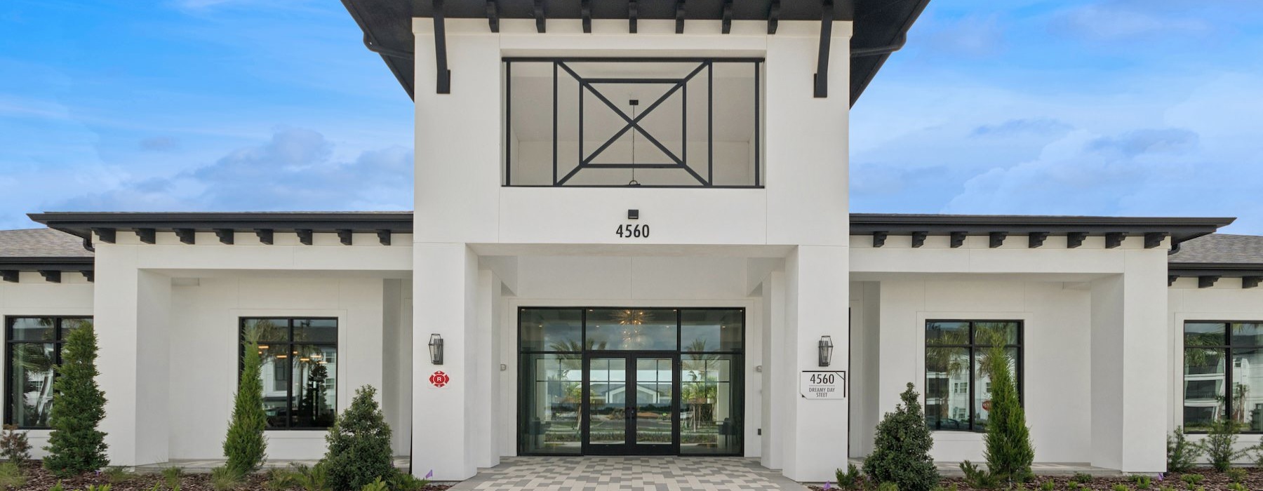 a white building with a large glass door