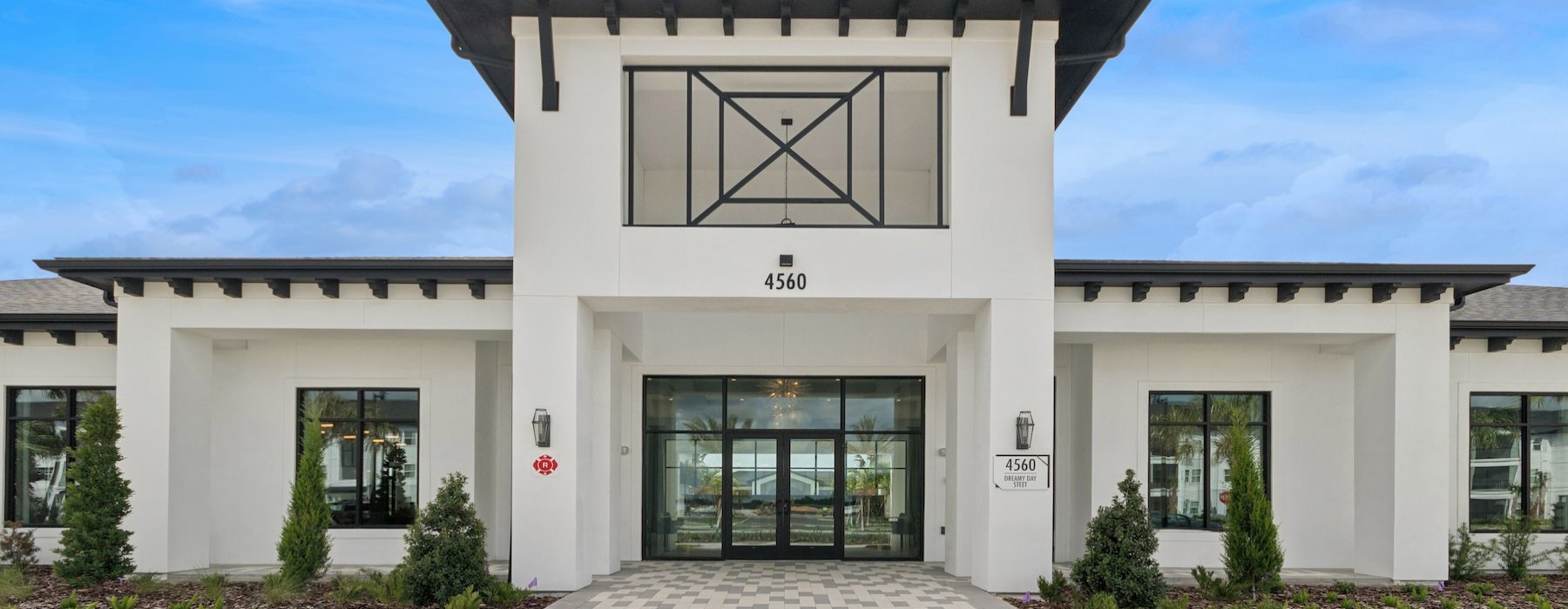 a white building with a large glass door