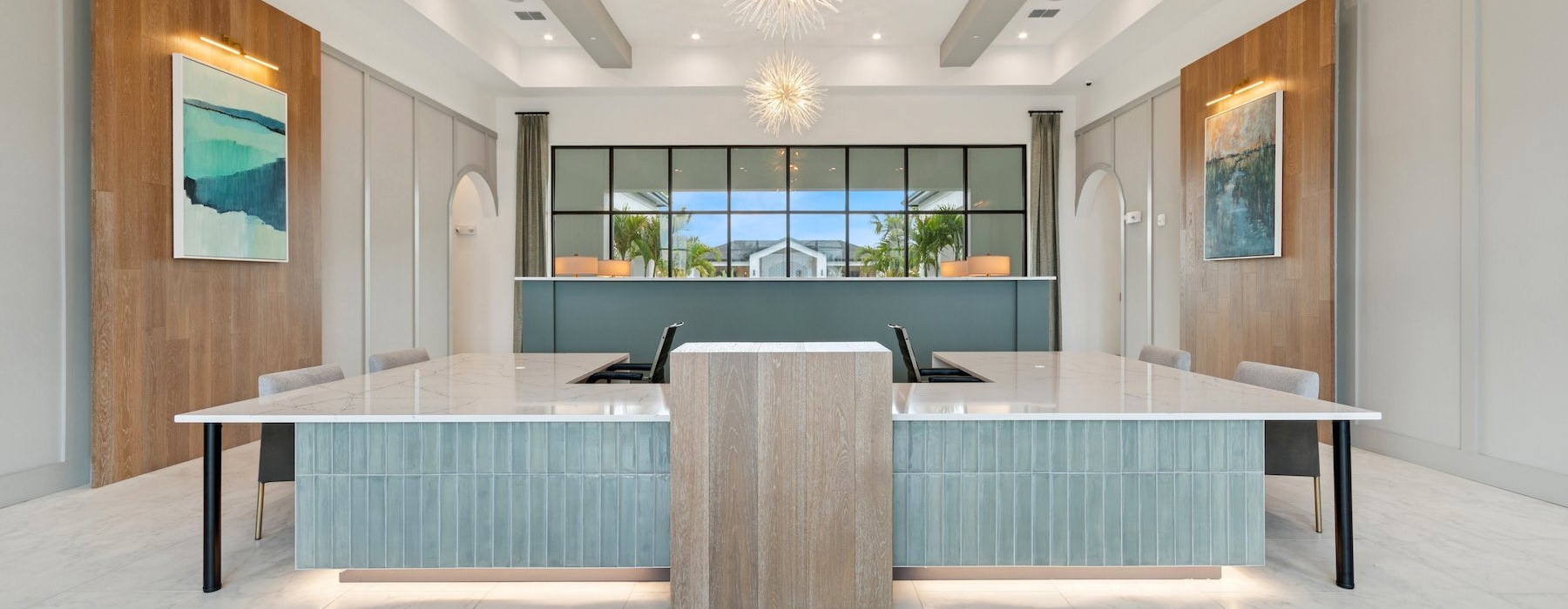 a leasing office front desk with chairs