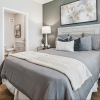 a bedroom with a bed and two nightstands