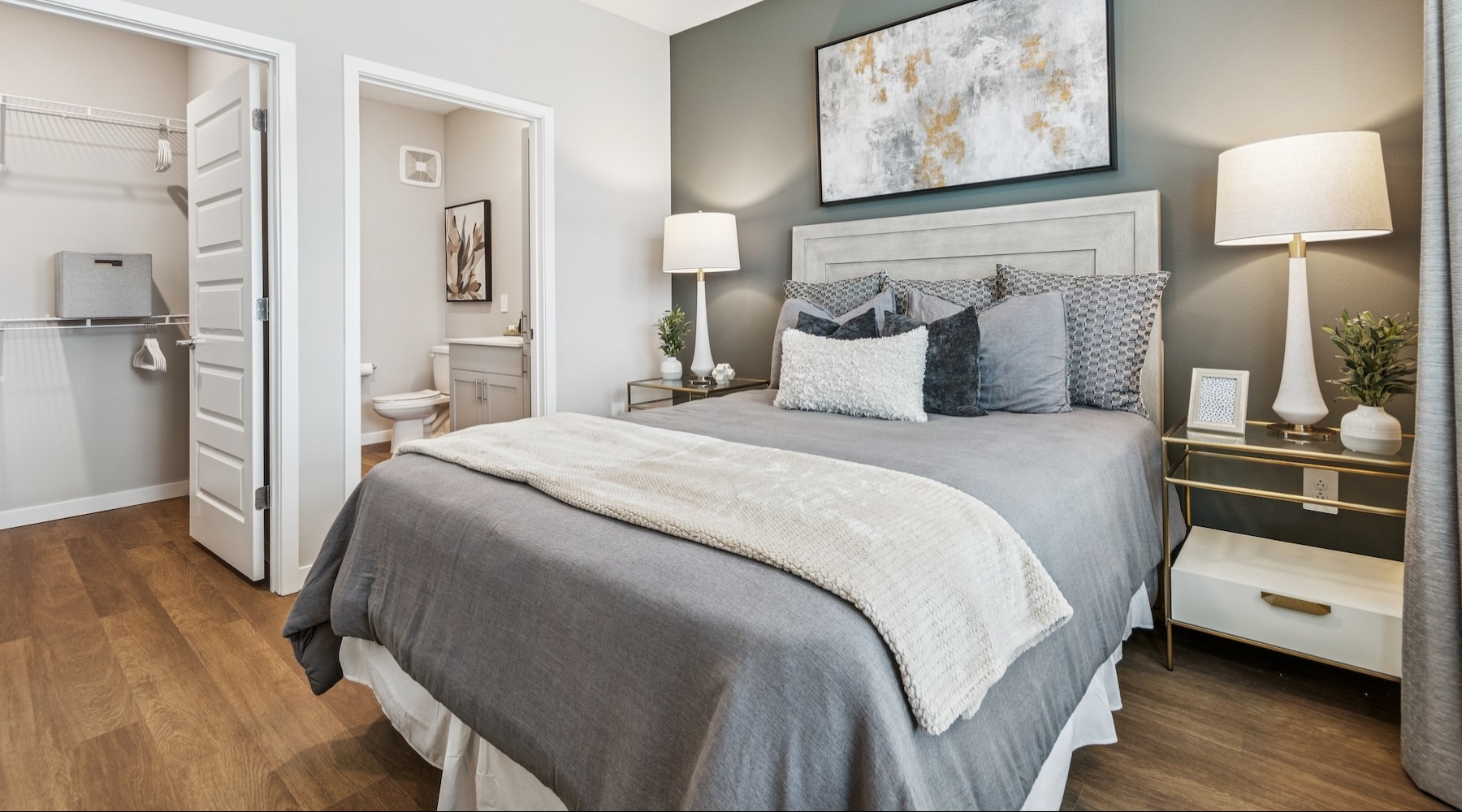 a bedroom with a bed and two nightstands