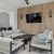 a patio area with a tv and couches