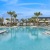 a swimming pool with palm trees