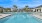 a swimming pool with palm trees