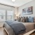 a bedroom with a bed and lamps