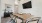 a private clubroom with a table, chairs and a tv